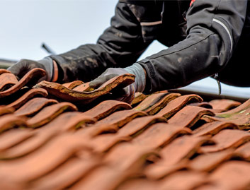 contractor fixing the clay tile roof